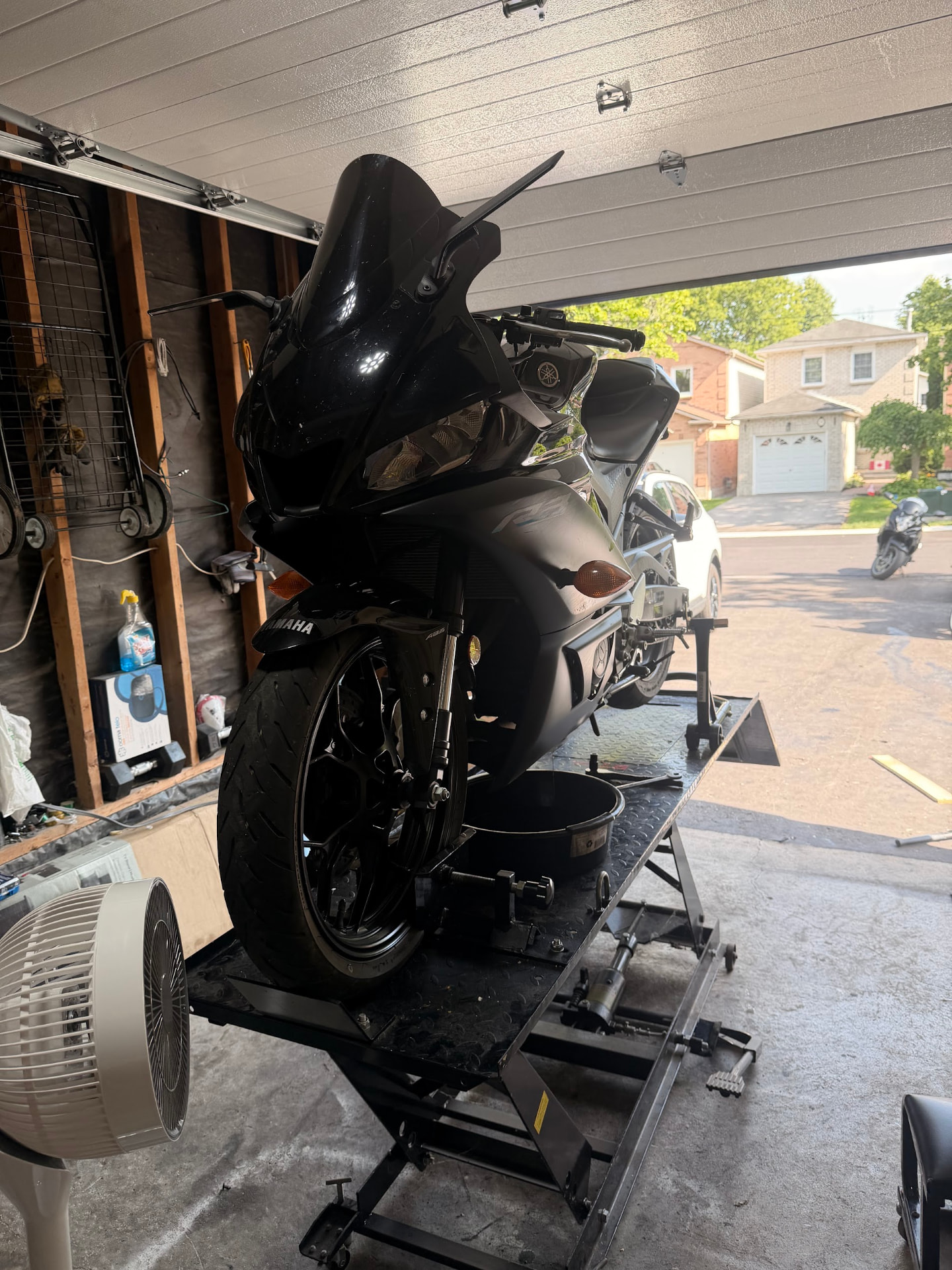 Black Yamaha sport bike on a lift at 2WheeledMechanic in Whitby, Ontario